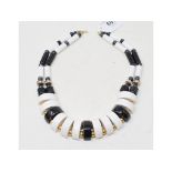 A black and white ceramic necklace, with hematite and other beads