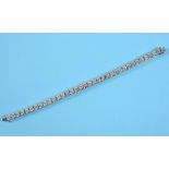 A substantial 14ct gold and diamond tennis bracelet, set 36 brilliant cut stones See front cover