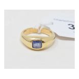 A yellow coloured metal and sapphire gypsy style ring, approx. ring size MÂ½ Report by NG Believed