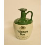 A bottle of Tullamore Dew whiskey, in a ceramic bottle, with original carton