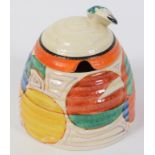 A Clarice Cliff Fantasque Melon honey pot and cover, chip to cover, 9.5 cm high See inside front