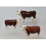 A Beswick Polled Hereford Bull, 2549A, a Hereford Bull, 1363A, and a Hereford Cow, 1360, all