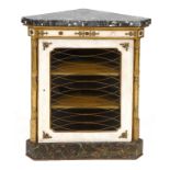 A painted and carved giltwood corner cupboard, the marble top above a glazed door with brass