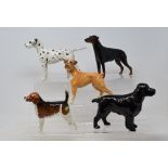 Eleven Beswick dogs, including Doberman, 3121, and Dalmation, 961, all gloss (11)