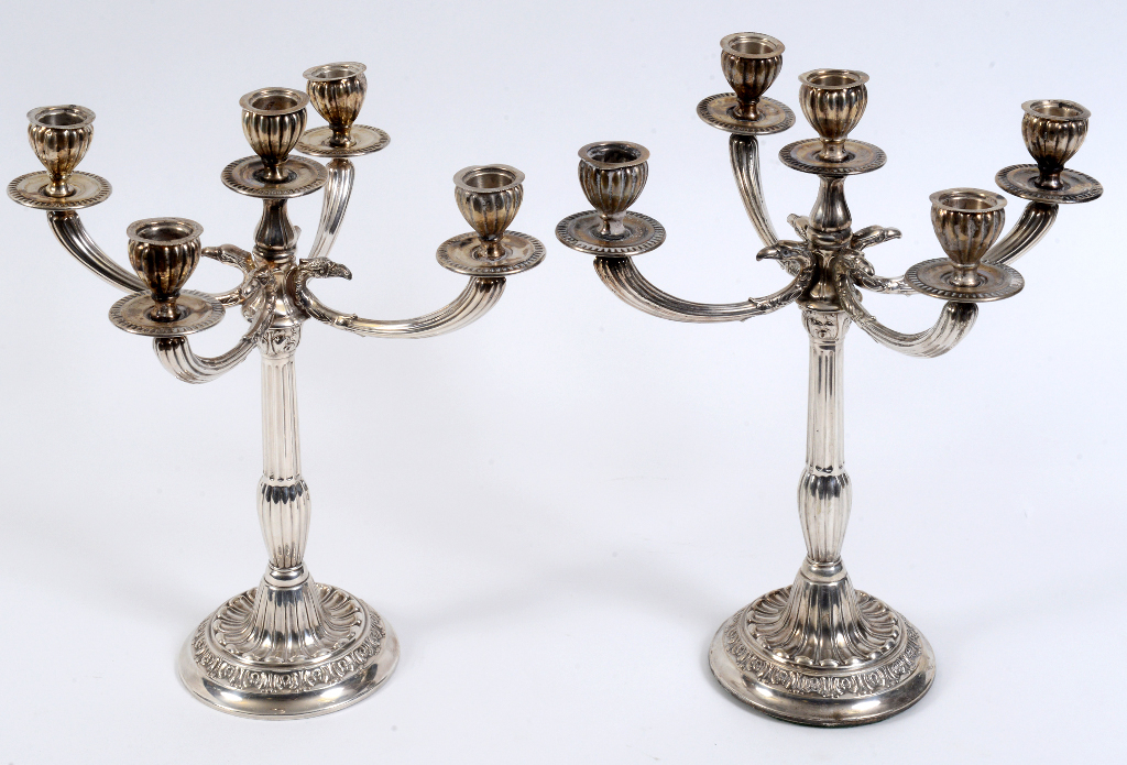 A pair of Italian five light silver coloured metal candelabra, with reeded and fluted columns, 31 cm