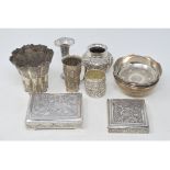 An Indian silver coloured metal vase, of trumpet lobed form, 10 cm high, and other similar bowls,