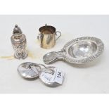 A silver coloured metal strainer, a pair of large silver coloured metal buttons, decorated