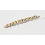 A 15ct gold, platinum and diamond bar brooch Report by NG Approx. 3.0 g (all in) 53 mm long
