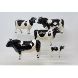 A Beswick Friesian Bull, 1439A, another, horns restored, a Friesian Cow, 1362A, leg glued,