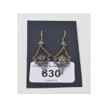 A pair of 9ct gold and silver basket drop earrings, set amethysts, peridots and a diamond Report