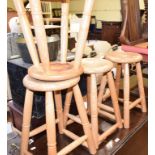 A set of four elm stools, 52 cm high