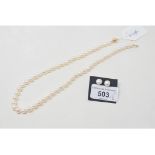 A cultured pearl necklace, with a 9ct gold clasp, and a pair of similar earrings (2)