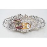 A late 19th/early 20th century German silver coloured metal dish, decorated strawberries and leaves,