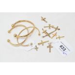 Assorted 9ct gold cross pendants, approx. 9.6 g, and three 9ct gold slave type bangles, approx. 15.8