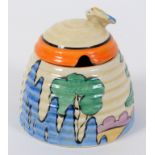 A Clarice Cliff Bizarre Orange Roof Cottage pattern honey pot and cover, with printed mark to base