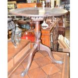 A George III mahogany birdcage tripod table, on a vase turned column, 70 cm diameter Report by RB