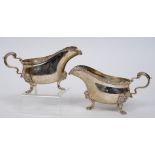 A pair of 18th century style silver sauce boats, of good gauge, with lion mask mounted legs,