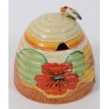 A Clarice Cliff Bizarre Nasturtium pattern honey pot and cover, cover restored, 9.5 cm high See