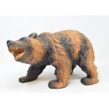 A Black Forest style carved wood grizzly bear, 38 cm wide