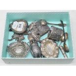 A group of small silver items, including a heart shaped photograph frame, bon bon dishes, a plated