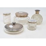 A silver mounted glass jar, Birmingham 1918, three other silver mounted glass jars, and a similar