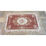 An Aubusson style needlework rug, decorated flowers, 120 x 181 cm