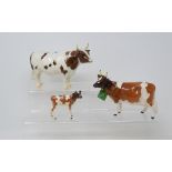 A Beswick Ayrshire Bull, 1454B, an Ayrshire Cow, 1350, hoof chipped, and an Ayrshire Calf, 1249B,