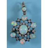 A Victorian opal and diamond brooch/pendant See front cover colour illustration Report by NG It is