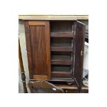 A mahogany linen press, of small proportions, with four sliding shelves, 54 cm wide, a tray top