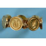 A yellow coloured metal multi wax seal ring, comprising seven seals, approx. ring size UÂ½,