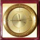 A Jaeger-Le Coultre mechanical alarm or boudoir clock, the circular dial with baton indices, and