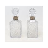 A pair of cut glass decanters, with French silver coloured metal collars, 24 cm high (2)