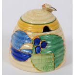 A Clarice Cliff Fantasque Melon honey pot and cover, bee finial restored, 9.5 cm high See inside