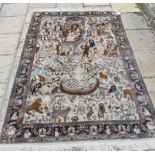 An Eastern rug, decorated figures and animals on a cream ground, within a multi border, 214 x 140 cm