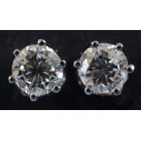 A pair of diamond stud earrings, in white coloured metal settings See inside back cover colour