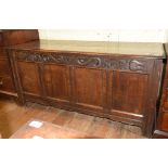 An oak coffer, initialled I P, the frieze carved tulips, on stile legs, 157 cm wide