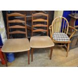 A pair of Ercol carver dining chairs, a G Plan dining table and four matching chairs (7)