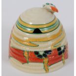 A Clarice Cliff Bizarre Fantasque Solitude pattern honey pot and cover, with printed mark to base,