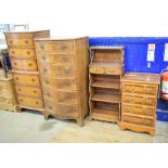 A walnut bow front chest on chest, of small proportions, 55 cm wide, a similar chest of drawers,