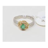 An 18ct gold, emerald and diamond ring, approx. ring size LÂ½ report by NG Approx. 3.8 g (all in)