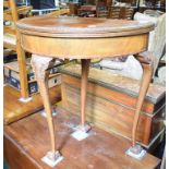 An 18th century style walnut D shape card table, on leaf carved cabriole legs with claw and ball
