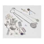 A large silver locket, a silver ingot and other silver jewellery