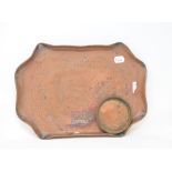 A Cornish copper tray, decorated a tin mine, 39 cm wide and a similar coaster (2)