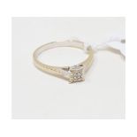 An 18ct white gold and illusion set diamond ring, approx. ring size M Report by NG It is approx. 2.1