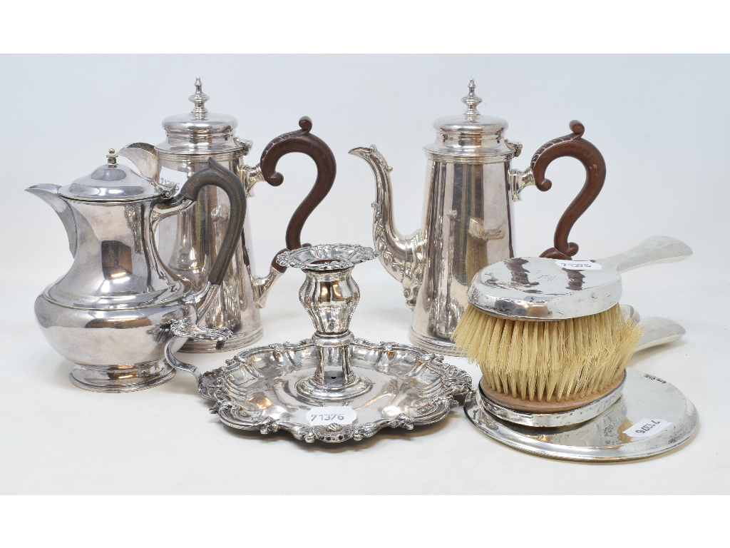 A silver plated two piece cafÃ© au lait set, a silver plated chamberstick, and other plated items (