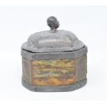 An early 19th century lead tobacco box and cover, 12 cm high, two tea caddies, a lead fire plaque,