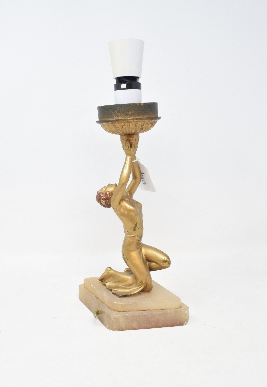 An Art Deco style table lamp, the support in the form of a kneeling figure, 34 cm high including