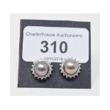 A pair of 18ct white gold, South Sea type pearl and diamond stud earrings