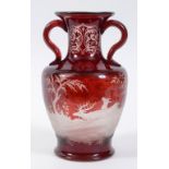 A Bohemian ruby glass vase, each side a stag and a doe, rim chipped and ground down, 27.5 cm high