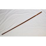 A walking cane, with a gold mount, with reeded decoration Report by GH Terminal is not marked or